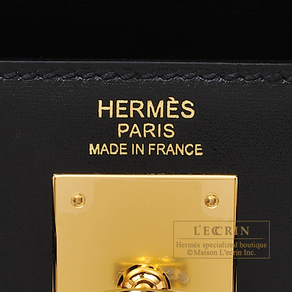 HERMES. A black calf box leather sellier Kelly 32, with …